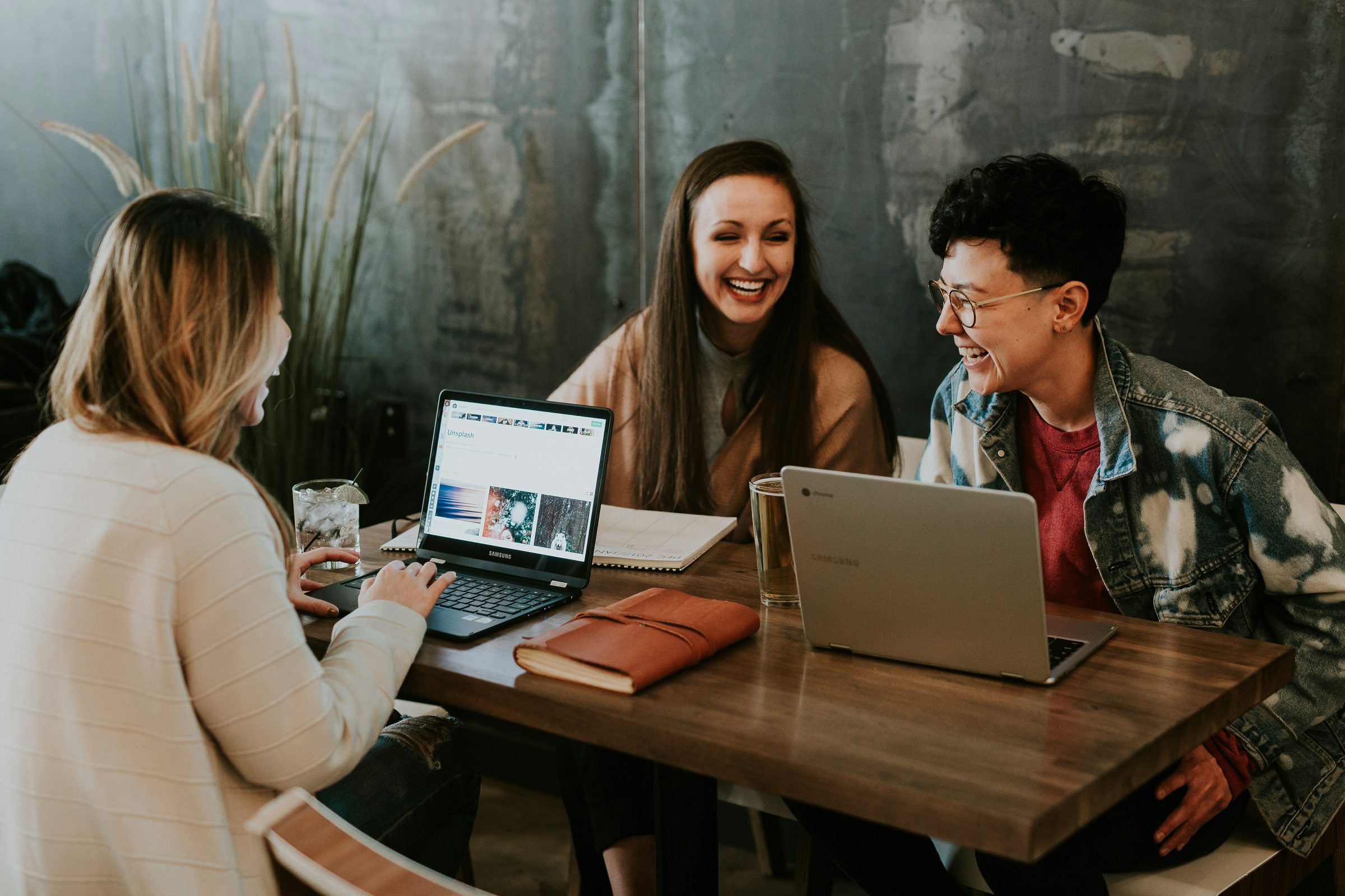 Three people working together at a table