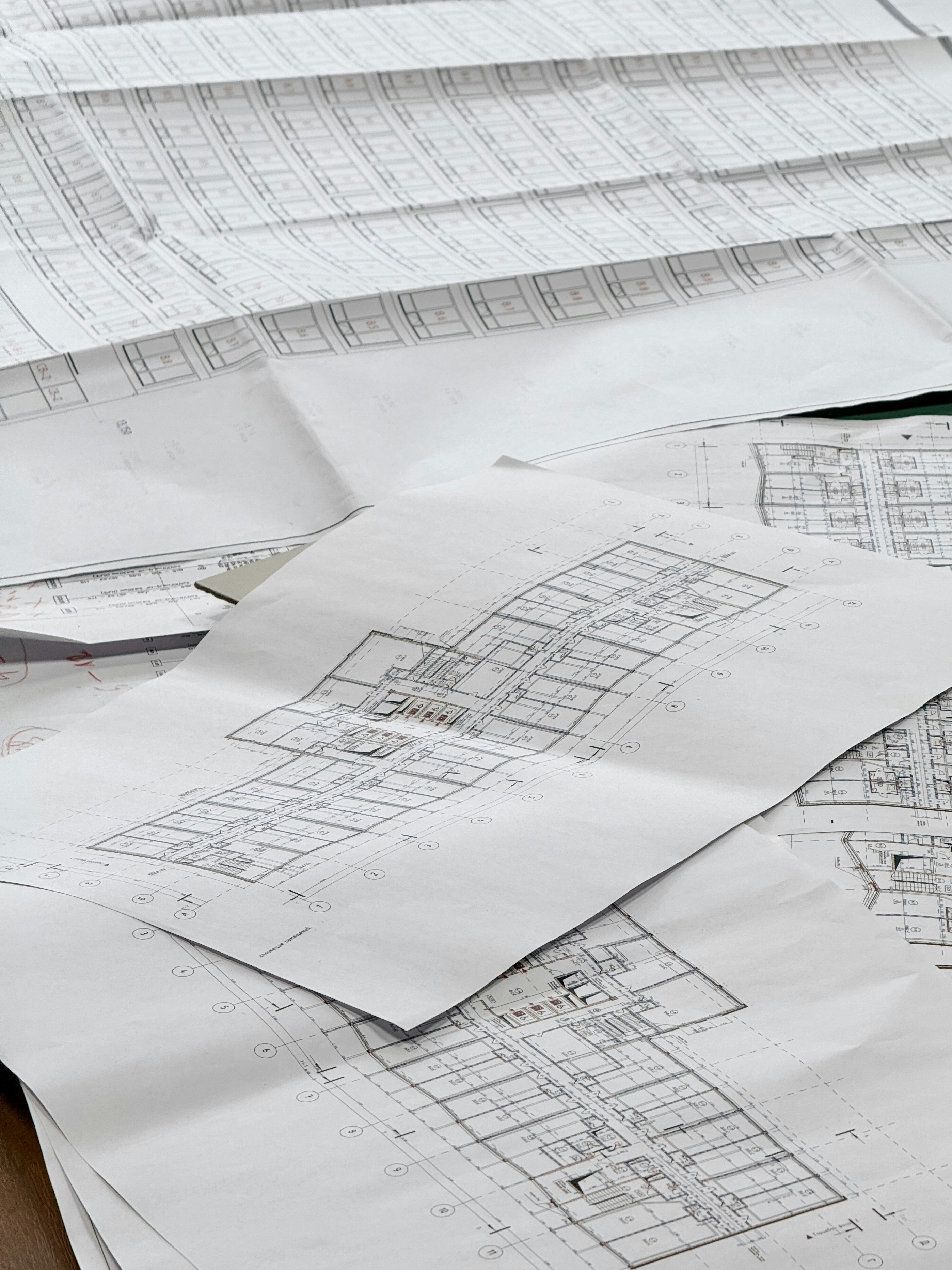 Architectural blueprints spread out on a surface